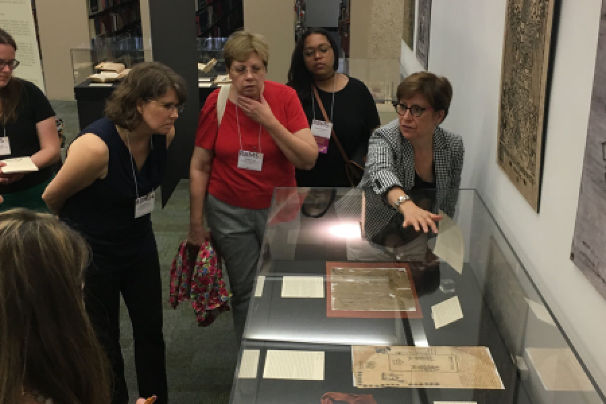 LAL Director Hortensia Calvo giving a tour of the library's Colonial Counterpoint exhibit.