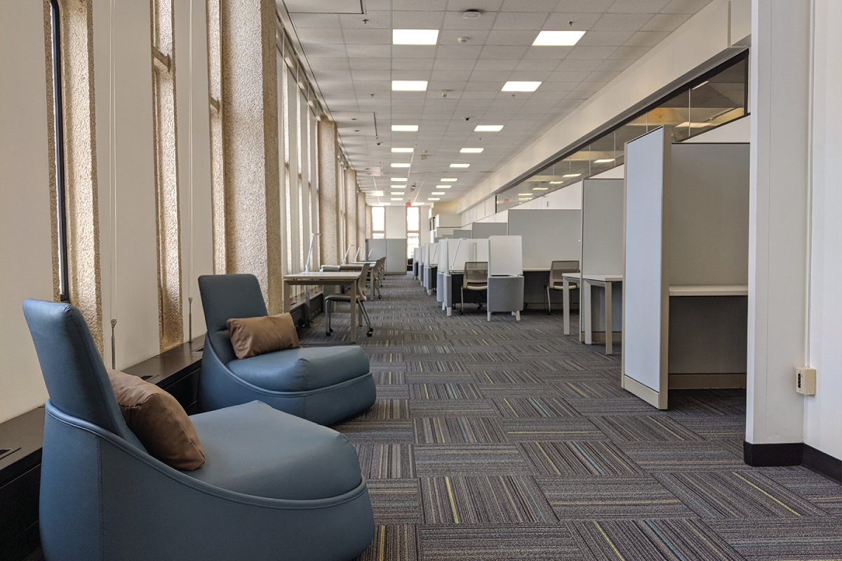 a view of multiple studying areas in the library